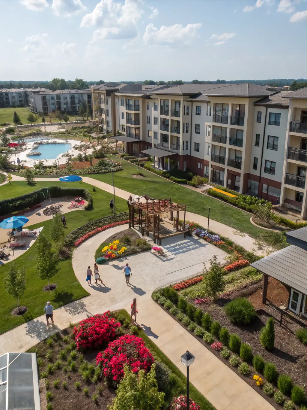 A modern, well-maintained multifamily apartment complex in Lubbock, Texas, with mature landscaping and ample parking, photographed on a sunny day to showcase its appeal to potential tenants.